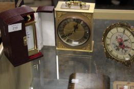 A CASED BRASS DAVID PETERSON CARRIAGE CLOCK TOGETHER WITH TWO OTHER CLOCKS (3)