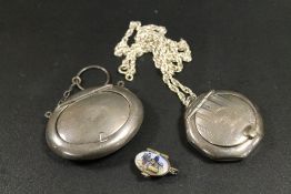 TWO HALLMARKED SILVER POWDER / SNUFF PENDANTS - A/F, TOGETHER WITH A SMALL ENAMELLED 'BASKET'