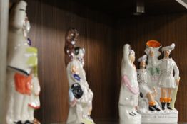 FOUR MODERN REPRODUCTION STAFFORDSHIRE FLATBACKS