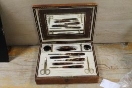 ANTIQUE MANICURE SET IN FITTED LEATHER CASE