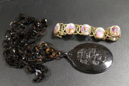 A VINTAGE GILT METAL BRACELET WITH INSET HAND PAINTED MOTHER OF PEARL PANELS, TOGETHER WITH A