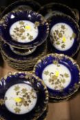 A TRAY OF CONTINENTAL BLUE AND GILT CERAMICS / DESSERT SET TO INCLUDE COMPORTS MARKED G.D.A. FRANCE