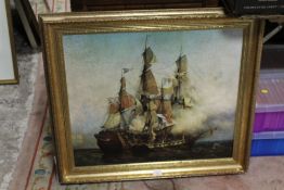 A REPRODUCTION GILT FRAMED PICTURE OF BATTLESHIPS AT WAR
