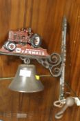 A MODERN REPRODUCTION CAST METAL WALL MOUNTED TRACTOR BELL