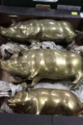 A SET OF THREE LARGE HEAVY BRASS GRADUATED PIGS - ONE BEING A MONEYBOX