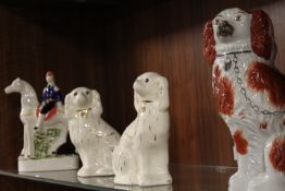 THREE MODERN REPRODUCTION STAFFORDSHIRE FLATBACK SPANIELS TOGETHER WITH A MAN ON HORSEBACK