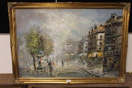 A GILT FRAMED OIL ON BOARD OF A CONTINENTAL STREET SCENE