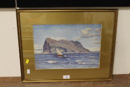 A GILT FRAMED AND GLAZED WATERCOLOUR OF A SAILING BOAT IN FRONT OF THE ROCK OF GIBRALTAR, SIGNED