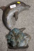 A CAST METAL LEAPING DOLPHIN DOOR STOP