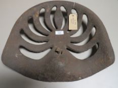 A VINTAGE CAST METAL TRACTOR SEAT
