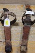 A PAIR OF EASTERN DAGGERS IN LEATHER SHEATHS WITH ARMBANDS