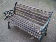 A CAST IRON/WOODEN GARDEN BENCH