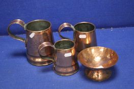 A GRADUATED SET OF THREE COPPER TANKARDS TOGETHER WITH A COPPER BOWL