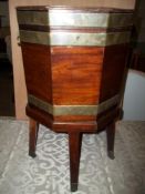 A MAHOGANY BRASS BANDED WINE BOTTLE CHILLER