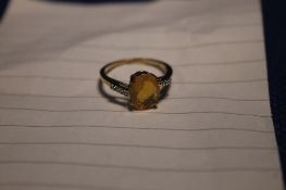 A 9CT DIAMOND AND OPAL RING SIZE O