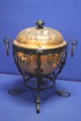A LARGE COPPER TWIN HANDLED LIDDED POT