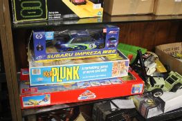 A COLLECTION OF BOXED TOYS AND GAMES TO INCLUDE A BOXED SUBARU IMPREZA KERPLUNK ETC