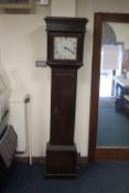 AN OAK CASED GRANDFATHER CLOCK