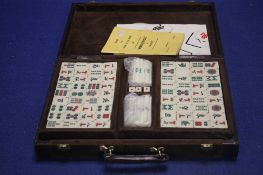 A VINTAGE MAH JONG SET IN GINO FERANI LEATHER CARRY CASE