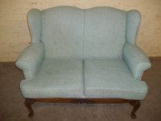 AN ANTIQUE 2 SEATER SOFA WITH GABMOCE SUPPORT