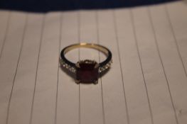 A 9CT RUBY AND DAMSON RING SIZE O