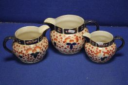 A SET OF 3 ENGLISH MADE GRADUATED JUGS