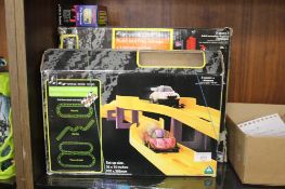 A BOXED EARLY LEARNING CENTRE MOTOR SQUAD BUILD AND PLAY GARAGE BOXED PENNY RACERS SUPER RACEWAY