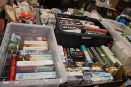 THREE TRAYS OF PAPERBACK MILITARY TYPE BOOKS (TRAY/S NOT INCLUDED)