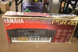 A BOXED YAMAHA PSR-48 ELECTRONIC KEYBOARD