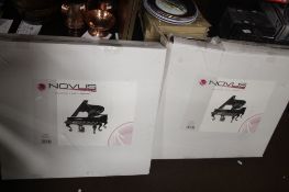 A PAIR OF BOXED METAL NOVUS GRAND PIANO WALL ART PIECES