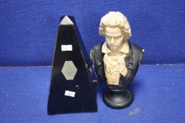 A RESIN BUST OF BEETHOVEN TOGETHER WITH A METRANOME