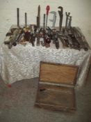 A WOODEN TOOLBOX AND CONTENTS