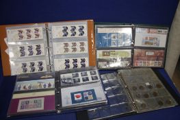 THREE ALBUMS OF STAMPS AND FIRST DAY COVERS TOGETHER WITH AN ALBUM CONTAINING A FEW HALF PENNYS