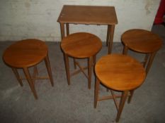 A RETRO TEAK DANISY NESTING TABLES IN THE STYLE OF POUL HUNDEVAD