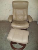 A LEATHER SWIVEL CHAIR AND STOOL