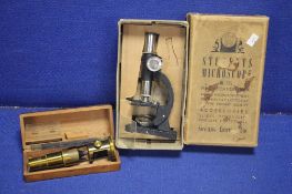 A BOXED STUDENTS MICROSCOPE TOGETHER WITH A TELESCOPE