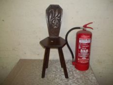 A SOLID OAK CARVED SPINNING CHAIR