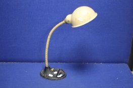 AN EARLY 20TH CENTURY ANGLE POISE DESK LAMP WITH CAST IRON BASE MARKED SUPREME