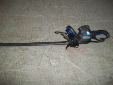 AN ELECTRIC HEDGE TRIMMER