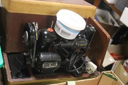 A CASED SINGER SEWING MACHINE
