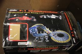 A BOXED FORMULA 1 SET INCLUDING CARS