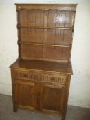 AN OAK NARROW DRESSER