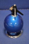 AN ENGLISH MADE SODA SYPHON ON WHITE METAL STAND