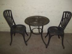 AN ALUMINIUM GARDEN TABLE AND TWO CHAIRS