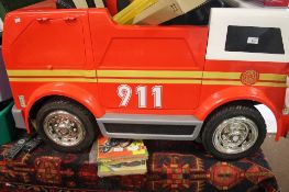 A CHILD'S BATTERY OPERATED FIRE ENGINE
