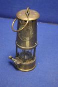 A BRASS ECCLES MINORS LAMP