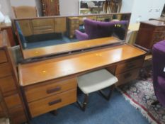 A MID CENTURY WHITE AND NEWTON LTD TEAK DRESSING TABLE AND STOOL W-167 CM