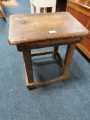 A RUSTIC WOODEN STOOL