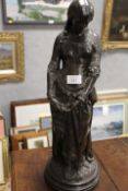 A BRONZED EFFECT STANDING LADY STATUE