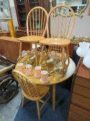 A MODERN KITCHEN TABLE AND FOUR CHAIRS
